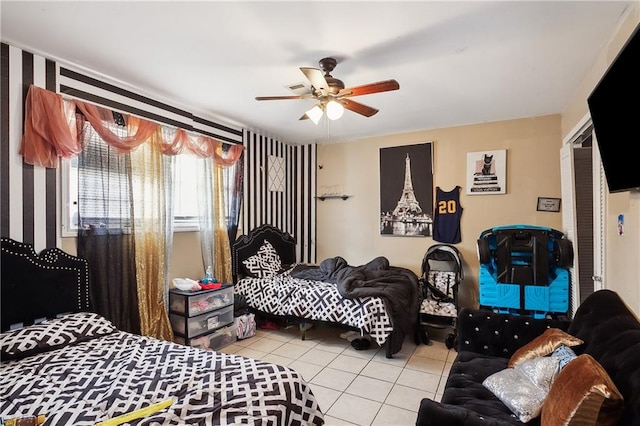 tiled bedroom featuring ceiling fan