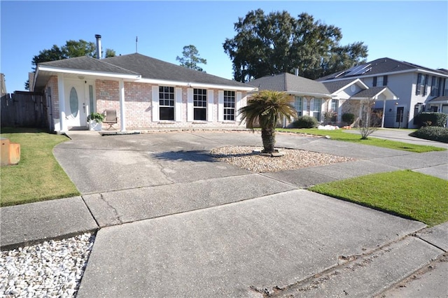 ranch-style home with a front yard