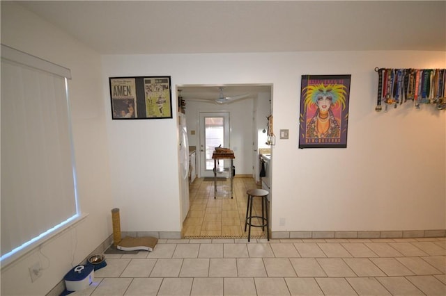 hallway featuring light tile patterned flooring