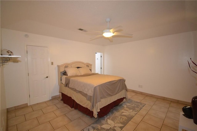 tiled bedroom with ceiling fan