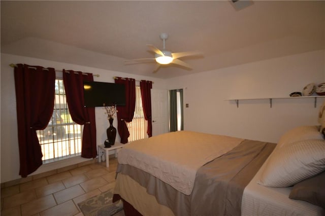 tiled bedroom with ceiling fan