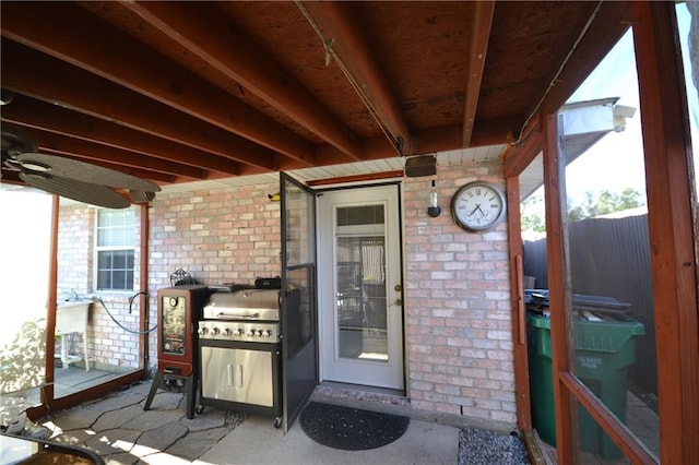 property entrance featuring area for grilling and a patio