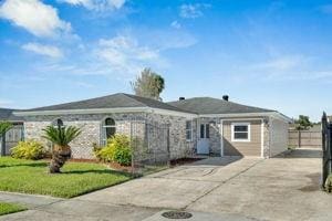 ranch-style house with a front lawn