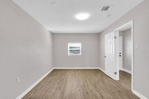 spare room featuring hardwood / wood-style floors