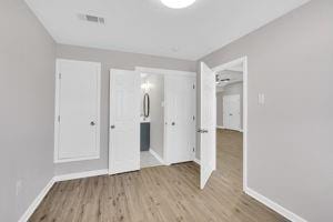 unfurnished bedroom with light hardwood / wood-style flooring