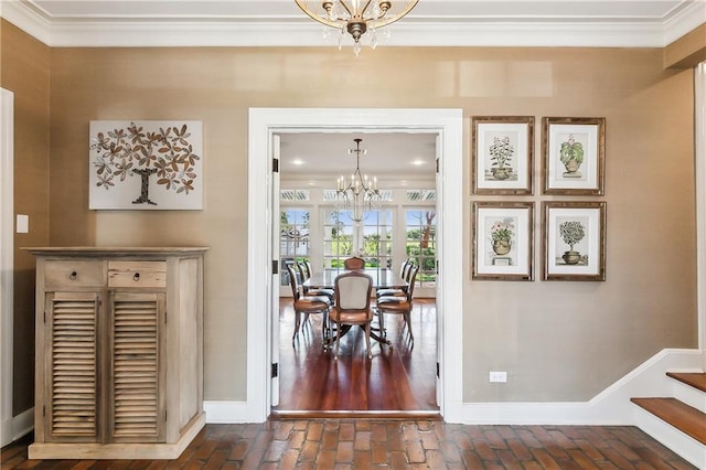 dining room with an inviting chandelier and crown molding