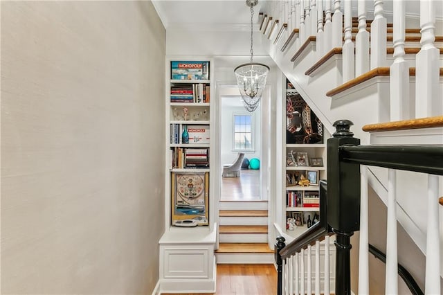 interior space with an inviting chandelier and hardwood / wood-style flooring