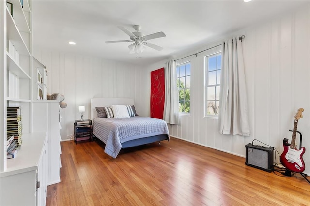 bedroom featuring hardwood / wood-style floors and ceiling fan