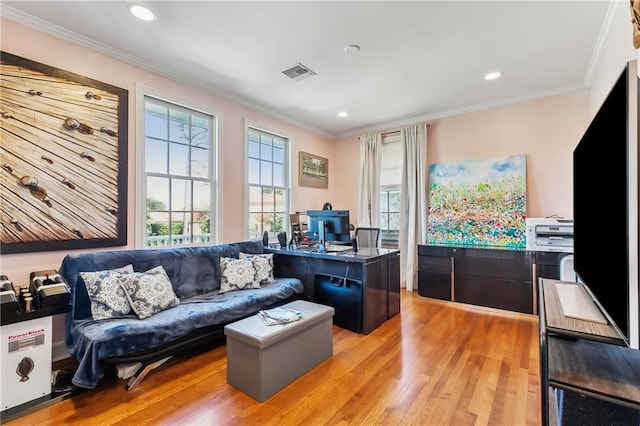 office space featuring light hardwood / wood-style flooring and ornamental molding