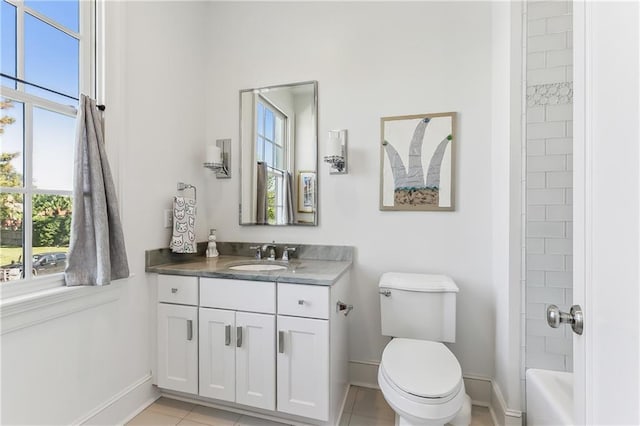 full bathroom with tile patterned floors, vanity, toilet, and tiled shower / bath