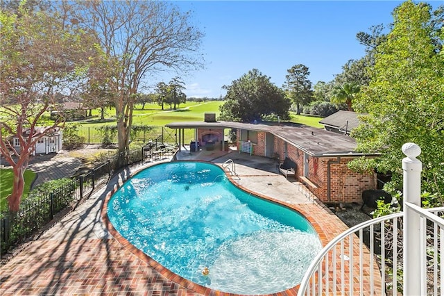 view of swimming pool featuring a patio area