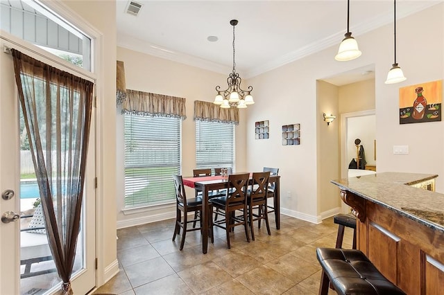 dining area with light tile patterned floors, a wealth of natural light, and crown molding