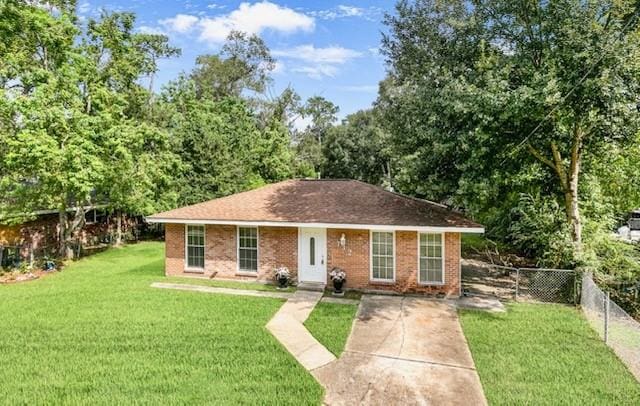 ranch-style home with a front lawn