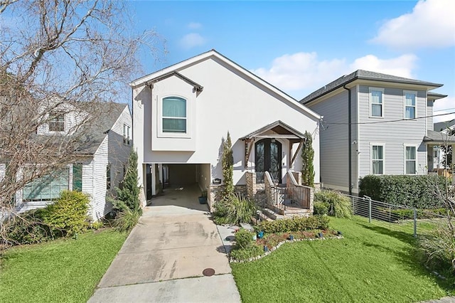 view of front of property with concrete driveway, stucco siding, a front lawn, and a carport