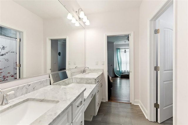 bathroom with double vanity and a sink