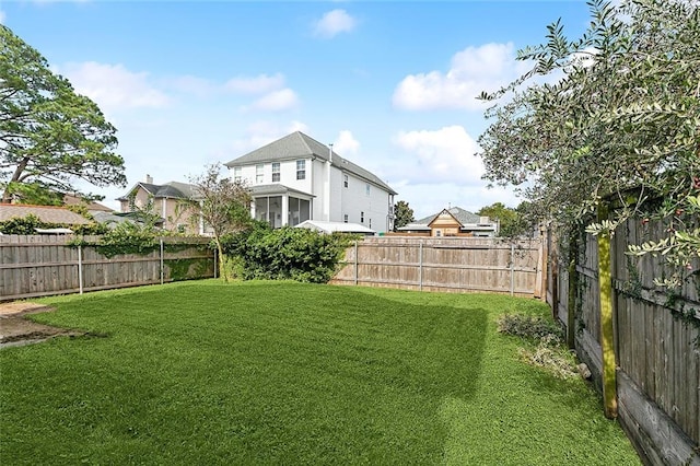 view of yard with a fenced backyard