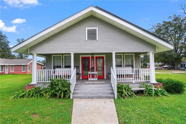 bungalow-style home with a front yard