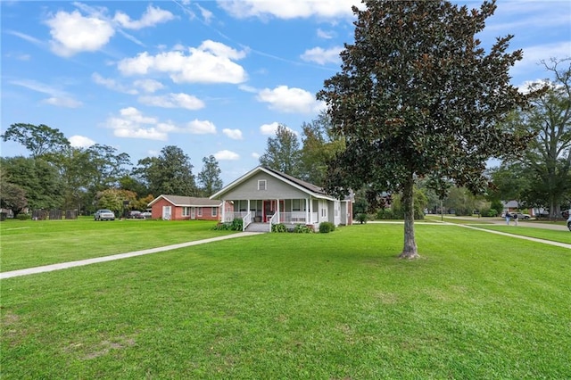 single story home with covered porch and a front lawn