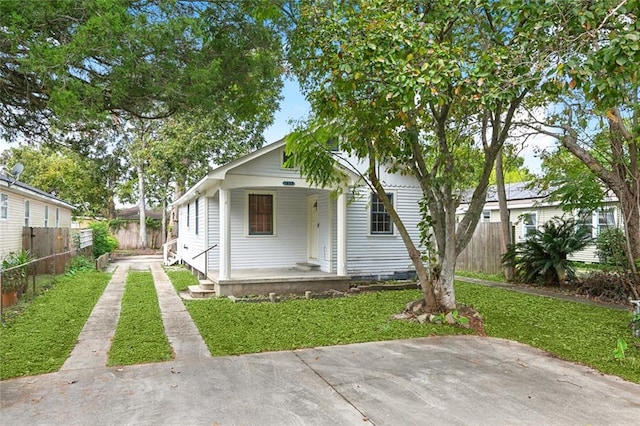 back of house featuring a porch