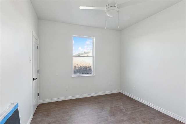 spare room with hardwood / wood-style floors and ceiling fan