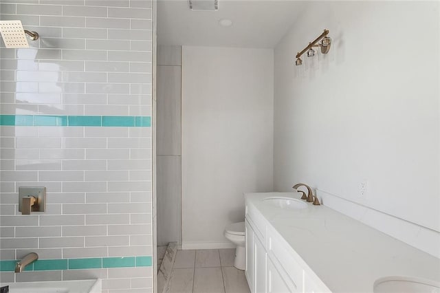 bathroom featuring tile patterned floors, walk in shower, vanity, and toilet