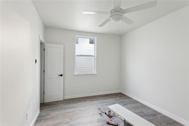 unfurnished room with light hardwood / wood-style flooring and ceiling fan