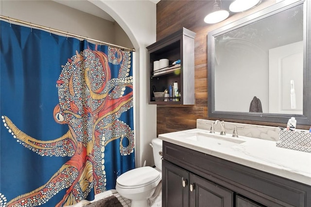 bathroom with wood-type flooring, vanity, and an inviting chandelier