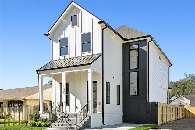 modern farmhouse featuring covered porch