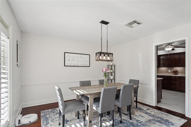 dining room featuring dark hardwood / wood-style flooring