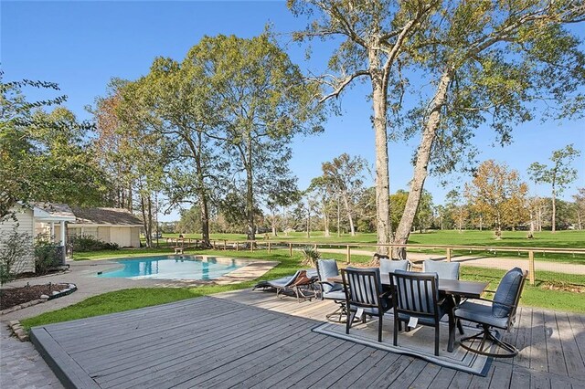 wooden terrace featuring a yard