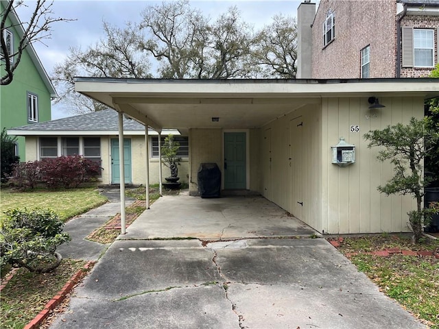 view of car parking with a carport and driveway