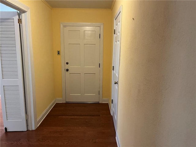 doorway featuring dark hardwood / wood-style floors and ornamental molding