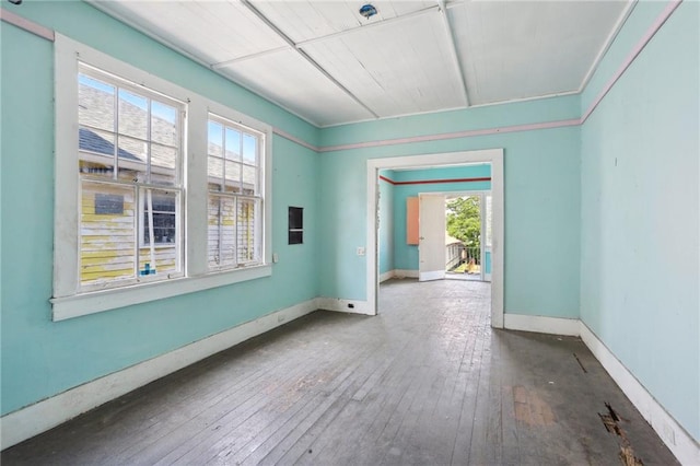 unfurnished room with wood-type flooring and a wealth of natural light