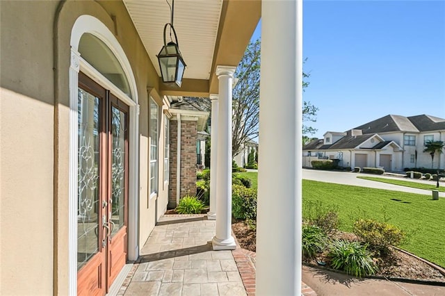 entrance to property featuring a yard