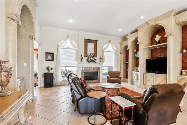 tiled living room featuring built in shelves, crown molding, and a premium fireplace