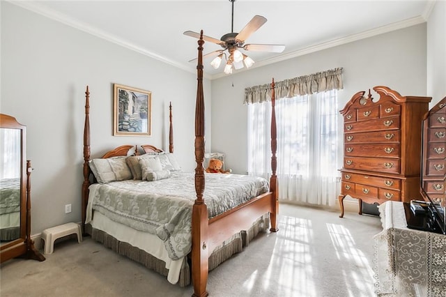 bedroom with ceiling fan, crown molding, and light colored carpet