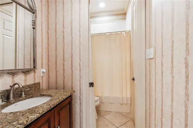 full bathroom featuring shower / bath combo, vanity, tile patterned floors, toilet, and ornamental molding