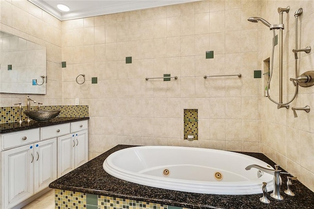 bathroom featuring plus walk in shower, vanity, tile walls, and ornamental molding