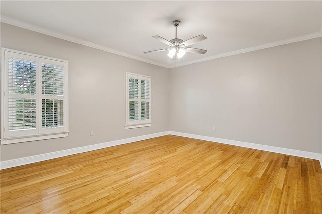 empty room featuring ceiling fan, light hardwood / wood-style flooring, and ornamental molding