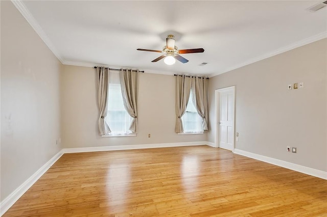 empty room featuring hardwood / wood-style floors, ceiling fan, and ornamental molding