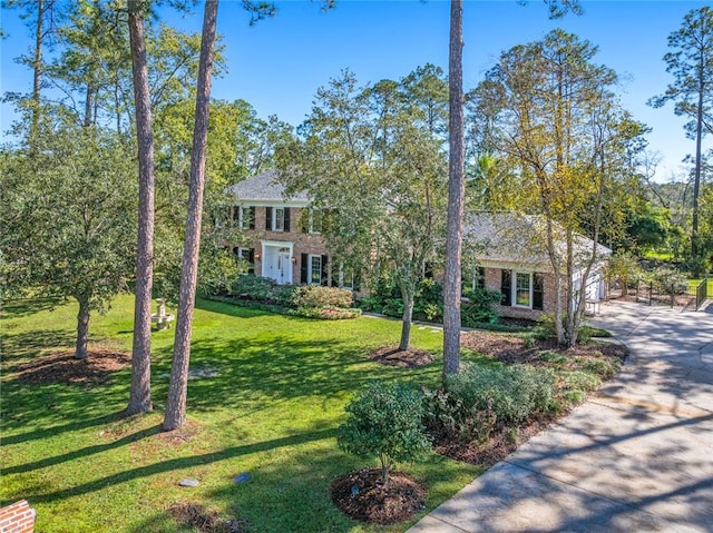 colonial inspired home with a front yard