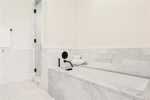 bathroom with shower with separate bathtub