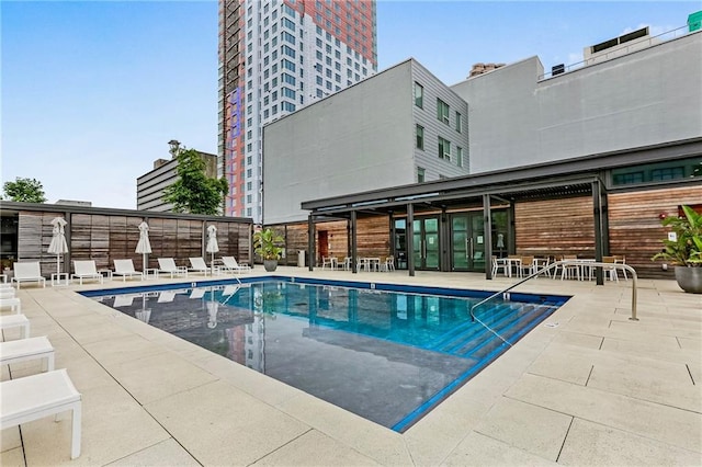 view of pool featuring a patio area