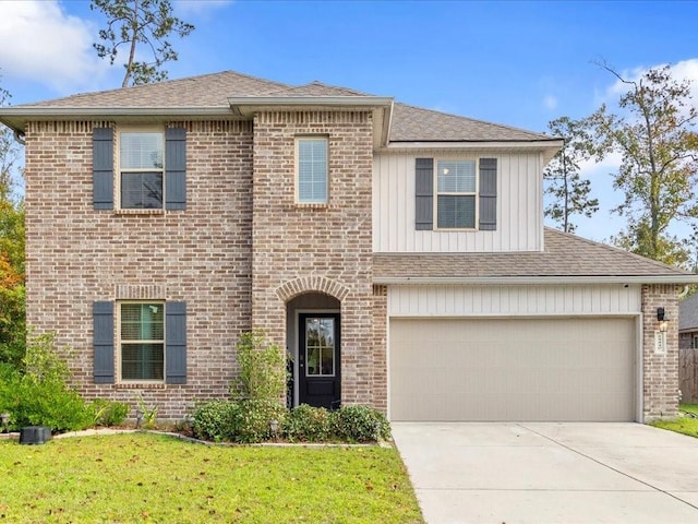 24440 Dawson Ct, Ponchatoula, LA 70454 - view of front of home featuring brick siding, concrete driveway, board and batten siding, a front lawn, and roof with shingles