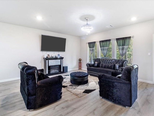 living room with light hardwood / wood-style flooring