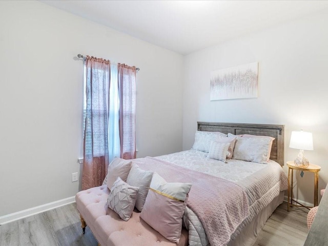 bedroom with light hardwood / wood-style flooring