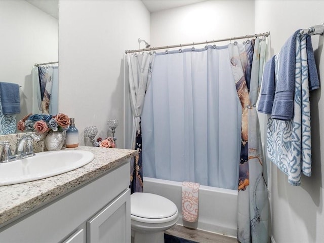 full bathroom with toilet, vanity, shower / bath combo, and hardwood / wood-style flooring