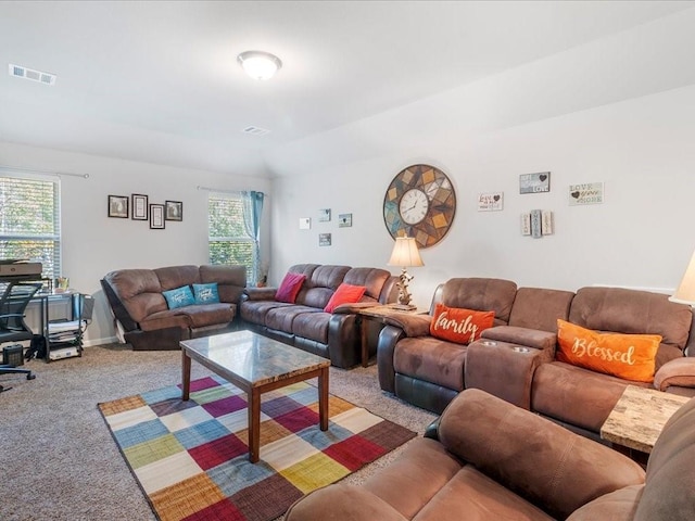 living room featuring a healthy amount of sunlight and light carpet