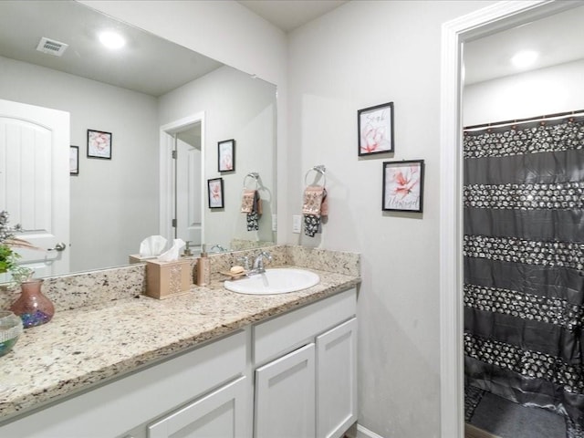 bathroom featuring vanity and walk in shower