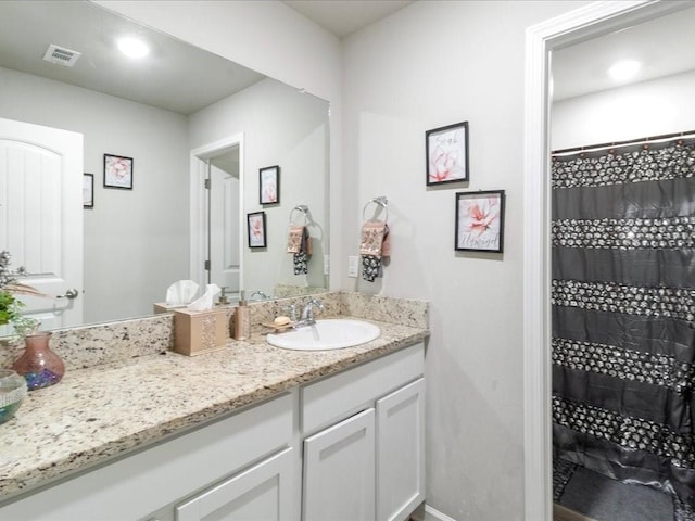 24440 Dawson Ct, Ponchatoula, LA 70454 - full bathroom featuring vanity, a shower with curtain, and baseboards